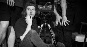 Parker sits on a dolly on set. Photo credit Jordan Skutar.