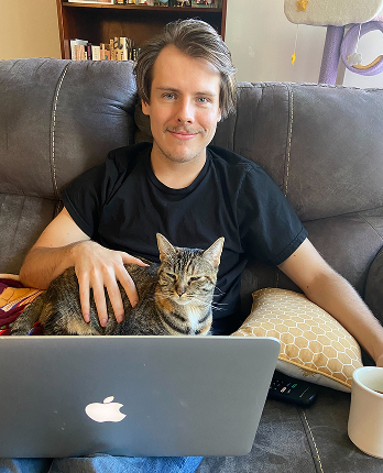 parker sitting with his cat Ingrid
